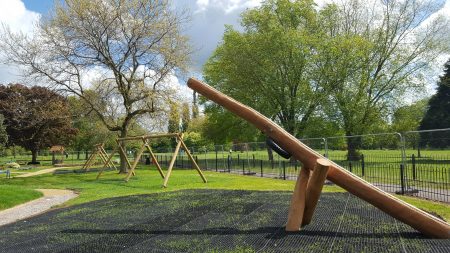New playground flooring, wooden structure to hold nest swing and traditional swings